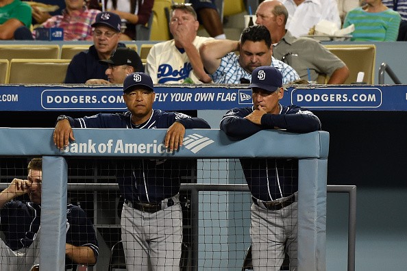 Coach Dave Roberts and manager Bud Black of the San Diego Padres