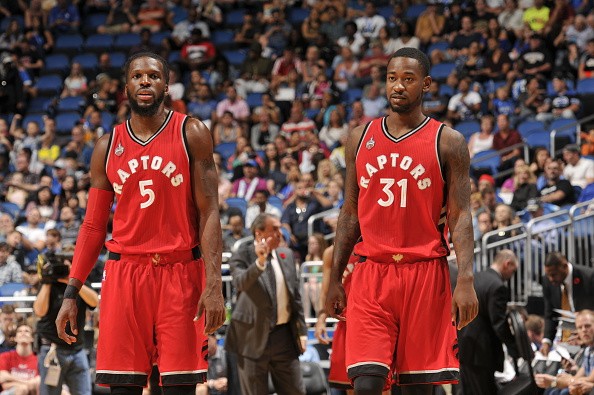 DeMarre Carroll #5 and Terrence Ross #31 of the Toronto Raptors