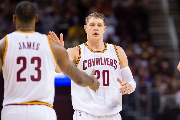 LeBron James #23 of celebrates with Timofey Mozgov #20 of the Cleveland Cavaliers 