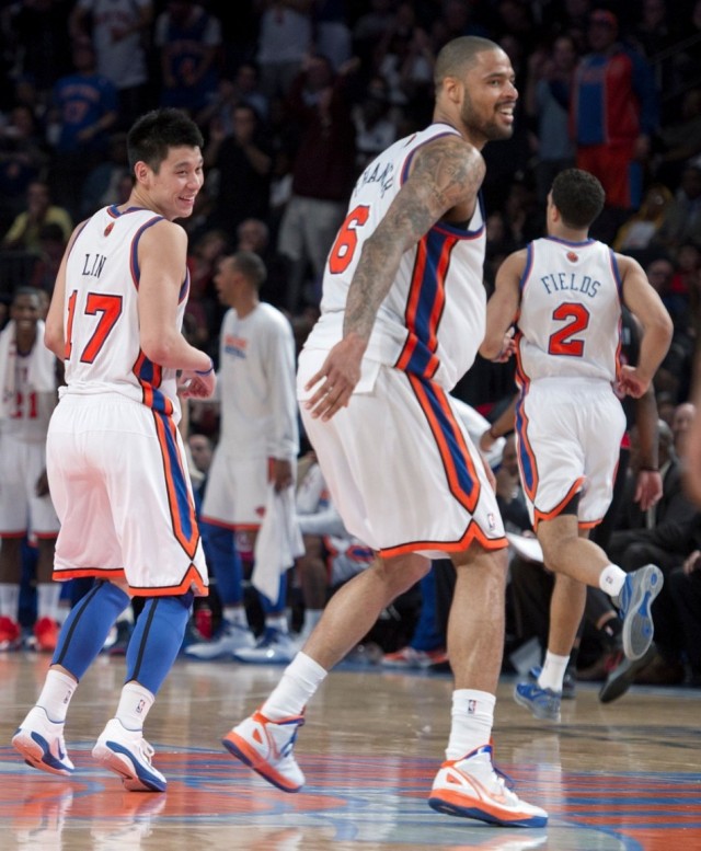 New York Knicks guard Jeremy Lin (17) and center Tyson Chandler (6) celebrate