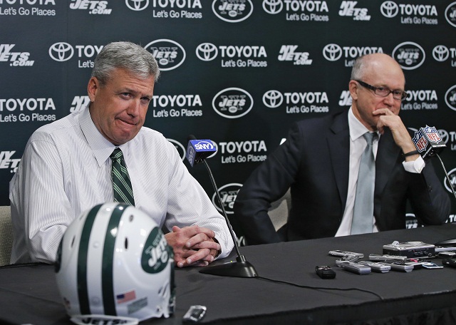 New York Jets owner Woody Johnson listens as head coach Rex Ryan 