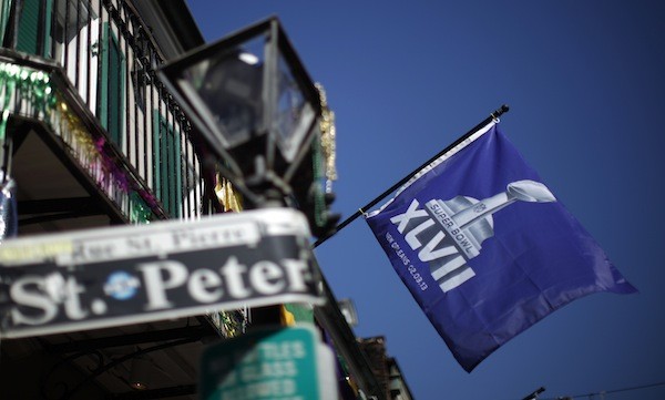 A Super Bowl flag hangs from a balcony in the French Quarter of New Orleans