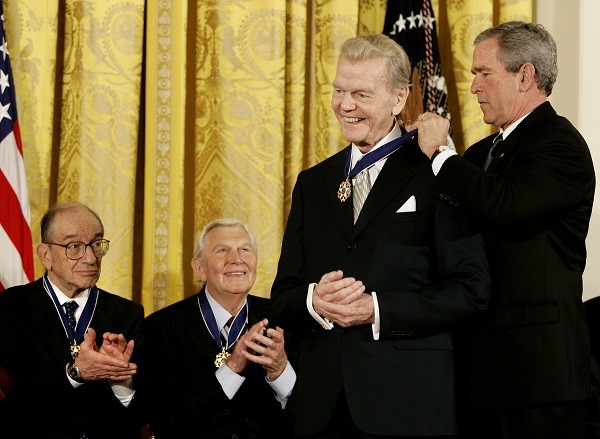 U.S. President George W. Bush awards his Presidential Medal of Freedom to long-term radio commentator Paul Harvey