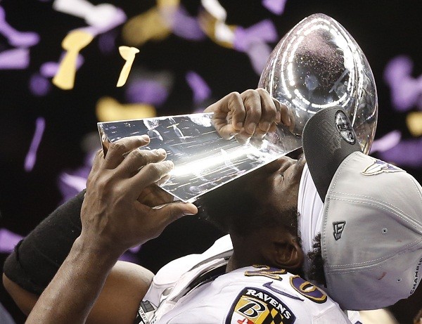 Baltimore Ravens free safety Ed Reed kisses the Vince Lombardi Trophy 