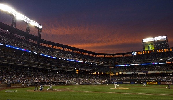 The sun sets behind CitiField as the New York Mets
