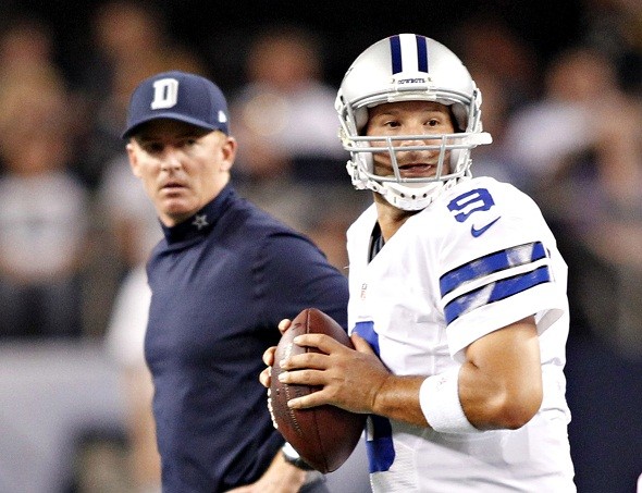 Dallas Cowboys head coach Jason Garrett watches quarterback Tony Romo