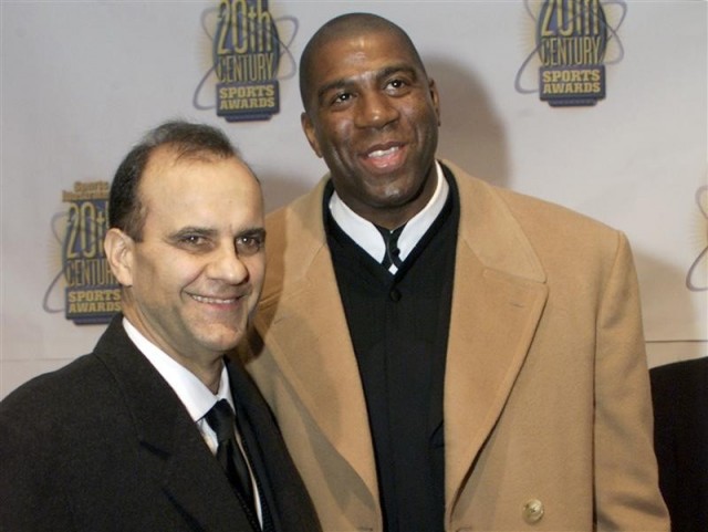New York Yankees manager Joe Torre poses with basketball great Magic Johnson 